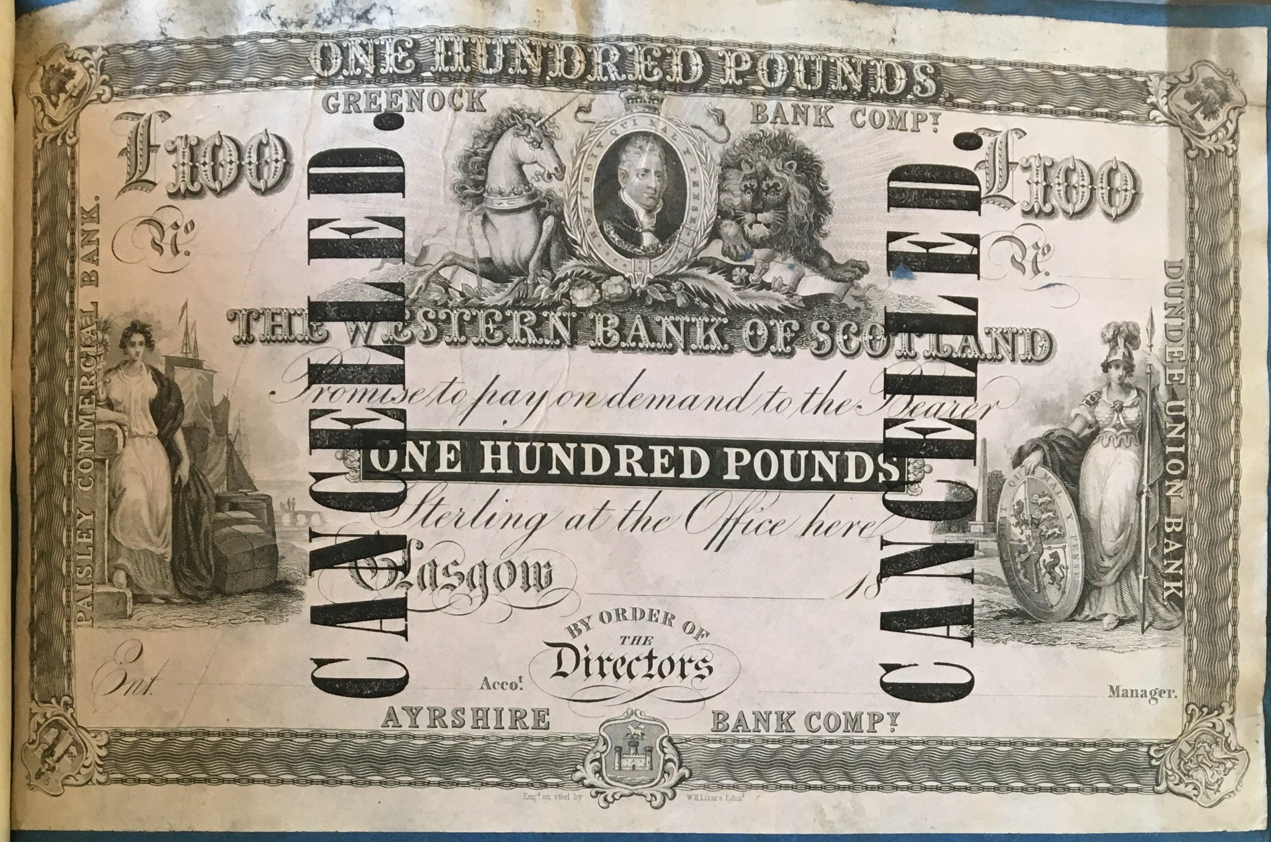 “One Hundred Pounds Notes from the Western Bank of Scotland, which has been cancelled due to the failure of the bank in 1857. Archives of the National Library of Scotland. Photo by Dana Brahm.” 
